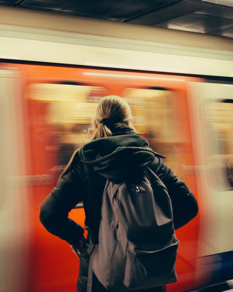 Woman wathing metro arriving